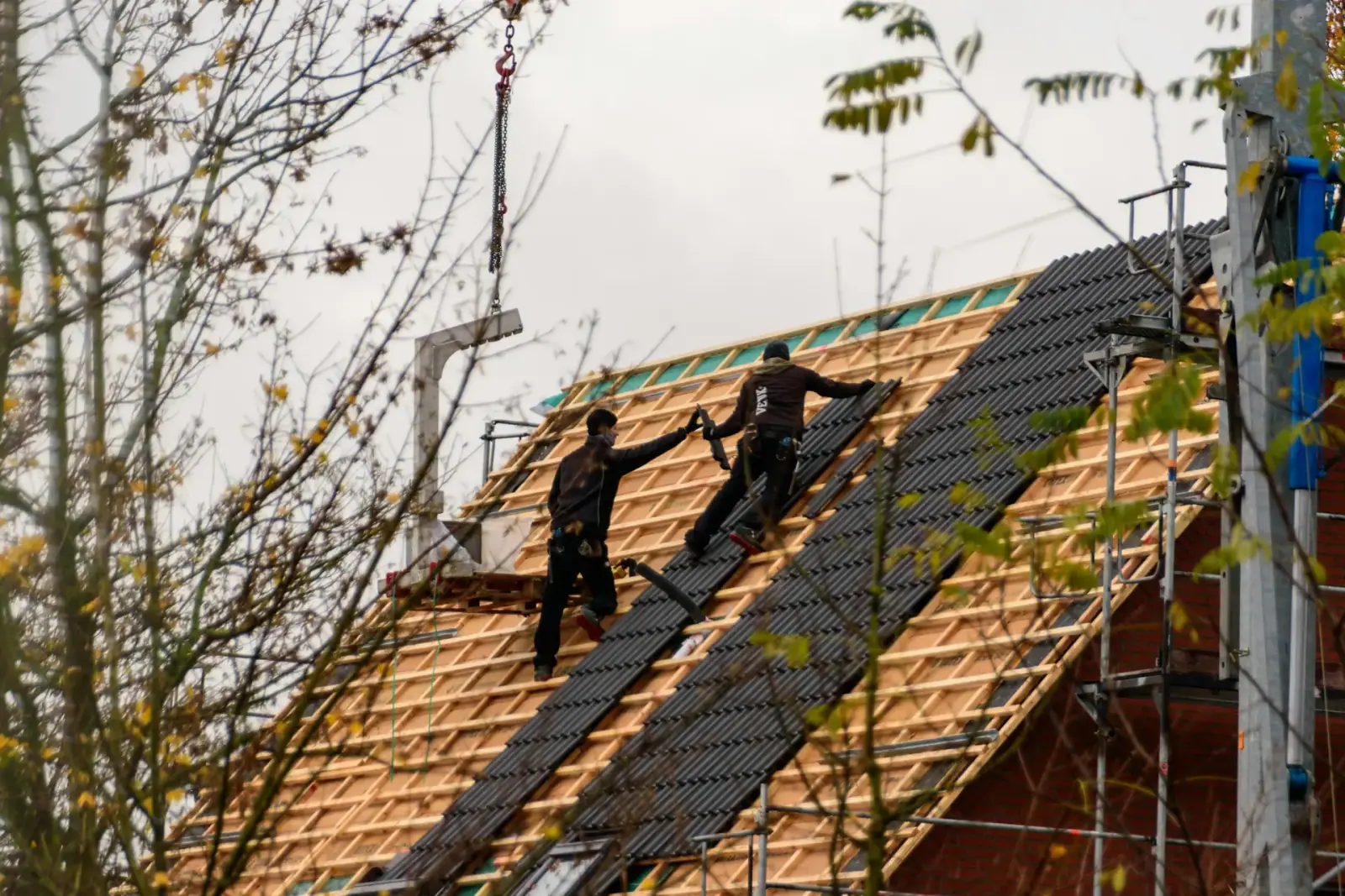 Roofing Software Development Services — Roofing and exterior construction imagery
